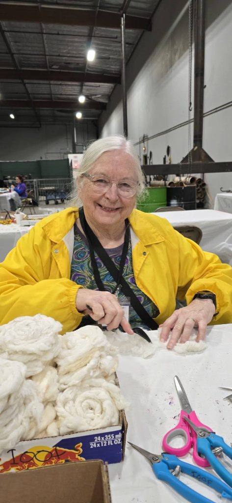 A photo of Debra making cotton rosettes taken by Myra Pittman