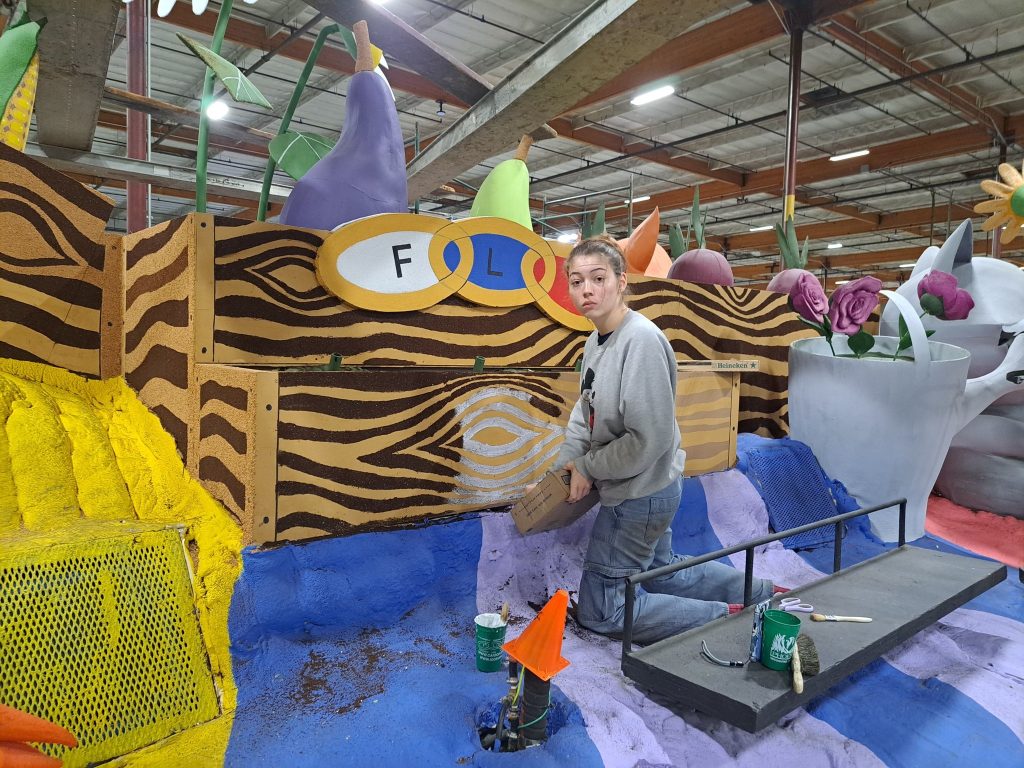 December 26 - Elizabeth has been gluing coffee on the camera side of the float since we got here at 3:20pm
